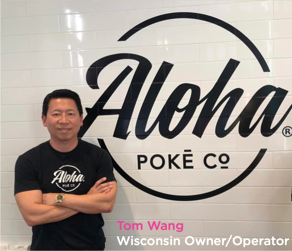 Franchise owner with Aloha Poke Sign